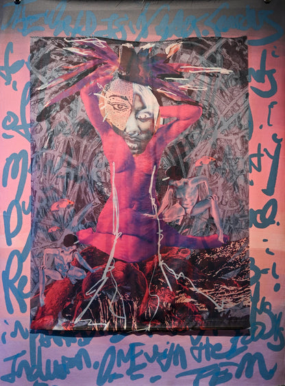 A large textile wall hanging or tapestry displayed on a gallery wall, featuring an abstract central figure in red and black with blue graffiti-style lettering around the border.